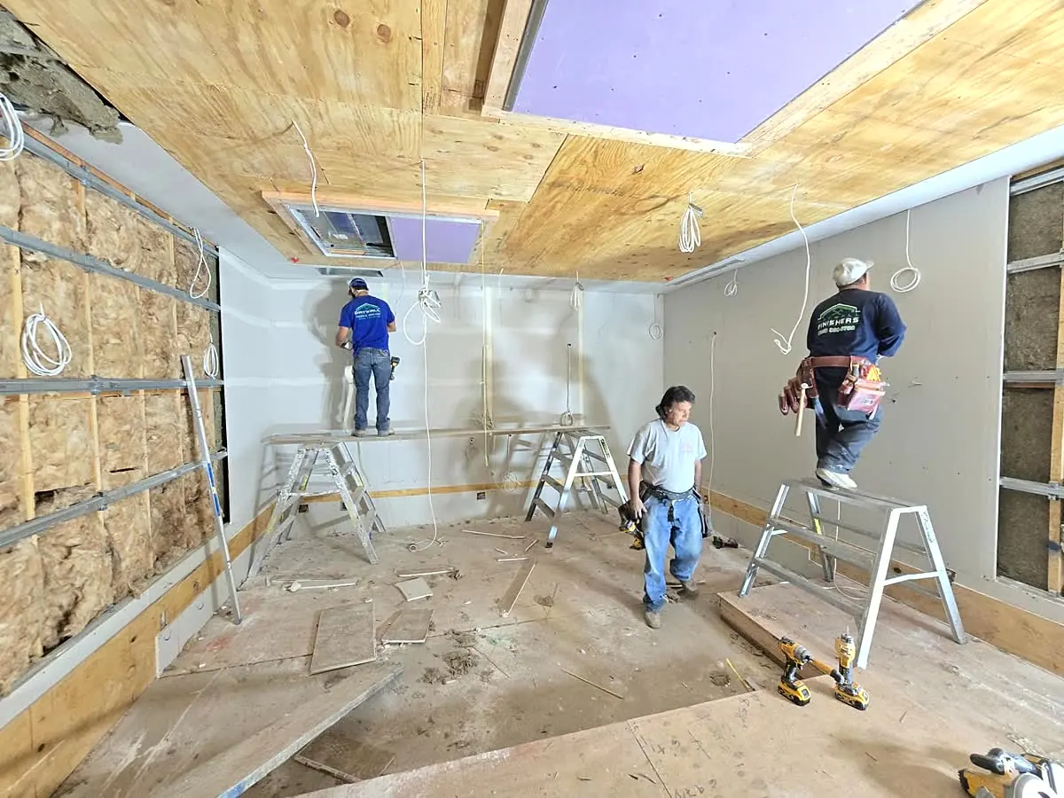 Smooth level-5 drywall ceiling finish after popcorn texture removal in SoCal — Commercial Build-Out